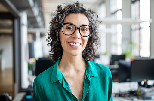 Woman with glasses smiling after visit to Riverwind Dental in Richmond, VA