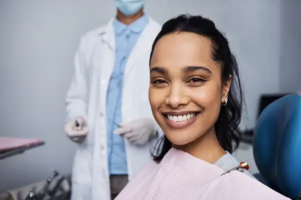 Smiling dental patient sitting in exam chair at Riverwind Dental in Richmond, VA
