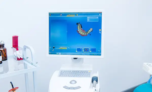 A computer screen displaying CAD/CAM dental design software, used in guided dental implant surgery at Riverwind Dental in Henrico, VA