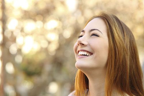 Young woman smiling with veneers at Riverwind Dental in Richmond, VA