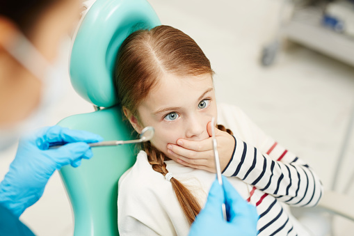 Patient with dental anxiety before her dental checkup.
