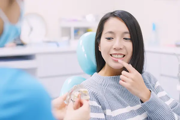 Doctor explaining the dental implant process to a patient at Riverwind Dental in Henrico, VA