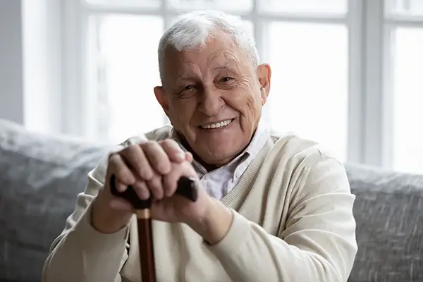 A portrait of a senior man smiling after sinus lift at Riverwind Dental in Henrico, VA